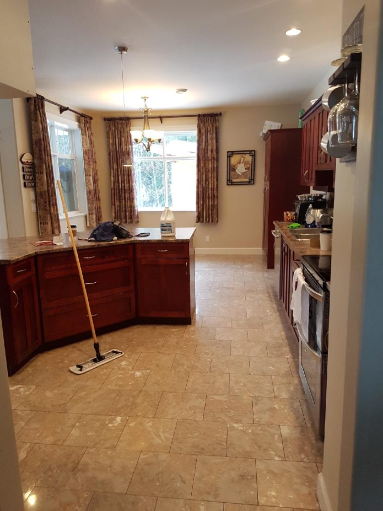 kitchen floor cleaned using flat mop