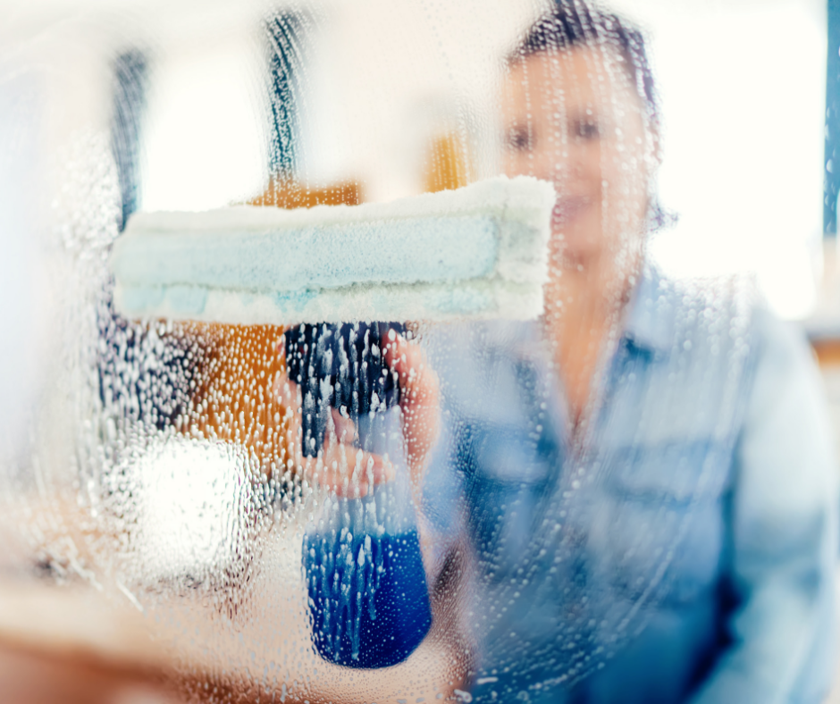 staff wiping the window glass