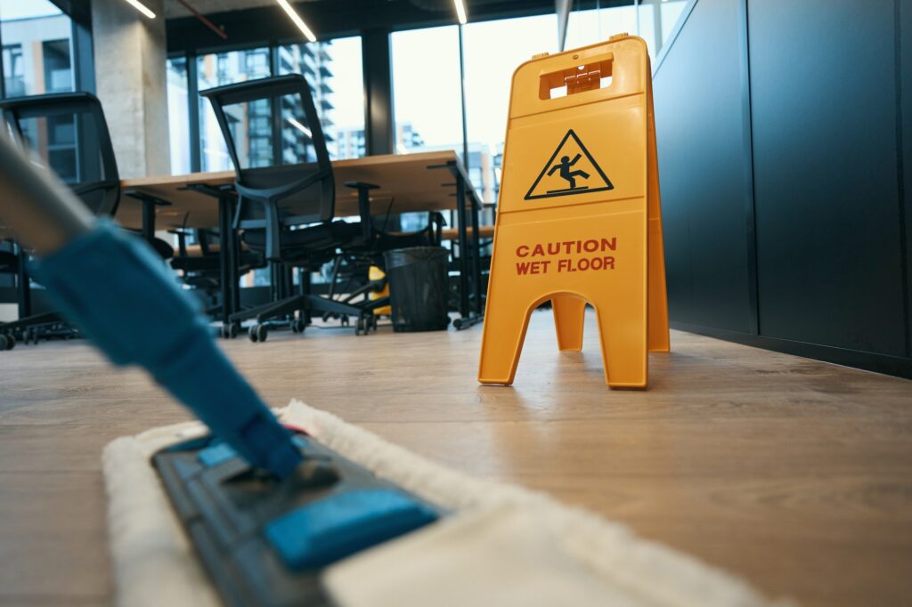 Building and Business Cleaning Service Cleaning with special mop in the modern office